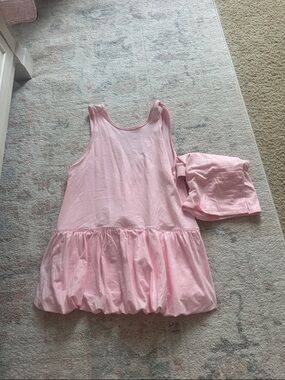 Cute little pink dress, can dress up or dress down! Has shorts that go with it